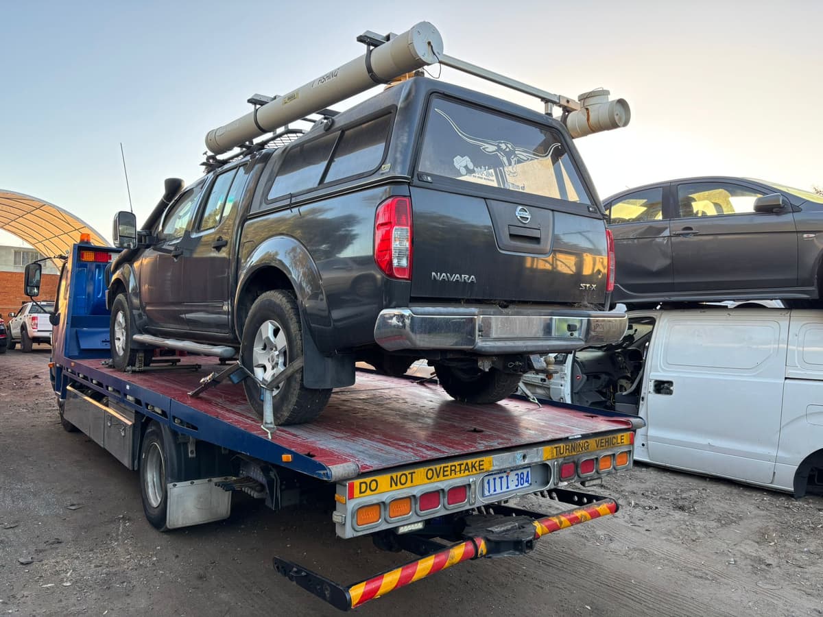 Midland Wreckers car yard and workshop with tow truck