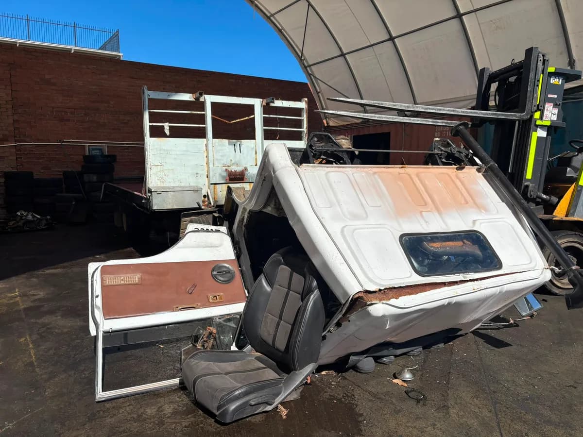Dismantled Toyota Dyna truck at Midland Wreckers yard with salvaged components