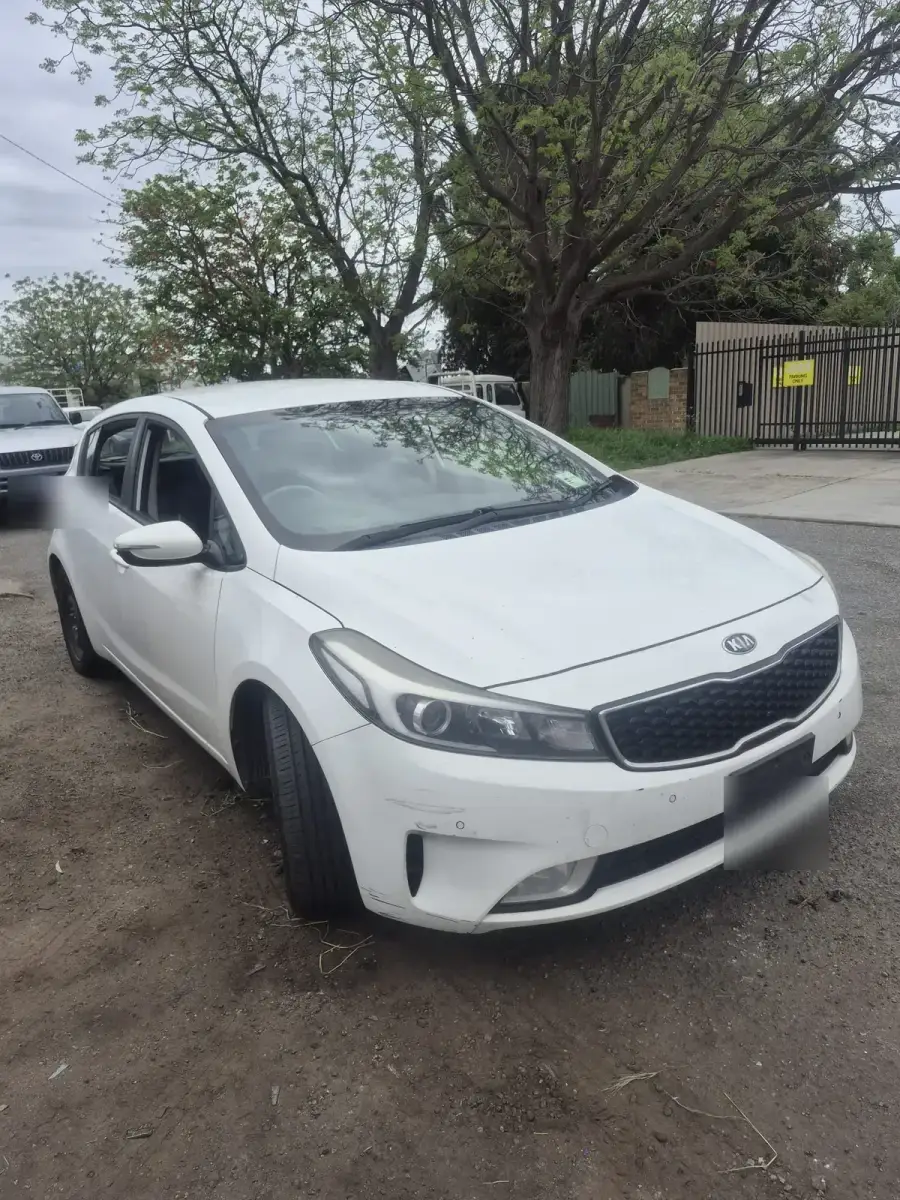 White Kia Cerato hatchback bought for dismantling at our Bellevue yard