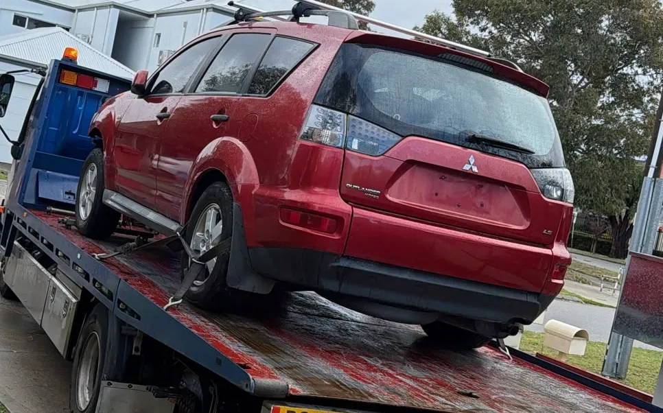 Red Mitsubishi Outlander picked up for cash in Maddington by Midland Wreckers