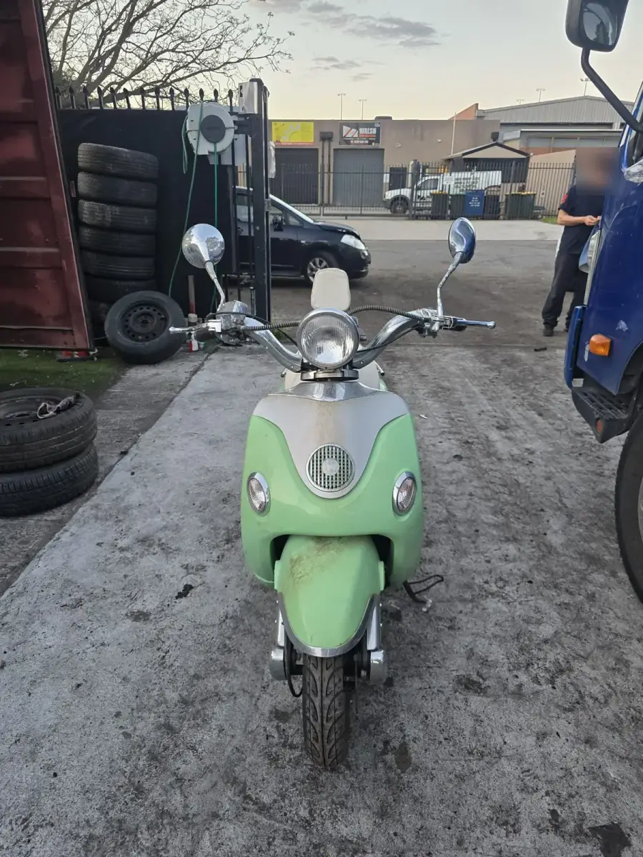 Retro scooter at Perth wrecking yard for eco-friendly recycling and parts salvage