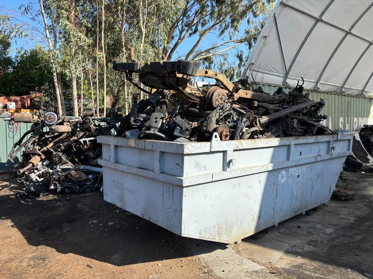 Dedicated fluid drainage and metal recovery bins at the Midland Wreckers recycling facility, Perth WA.